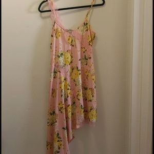 Floral print dress with asymmetrical hem.